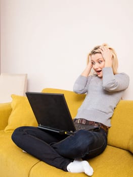 woman sitting on sofa and having coffee
