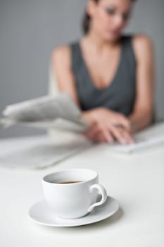 Successful businesswoman read newspaper at office