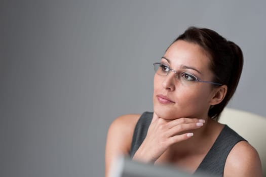 Thoughtful businesswoman thinking at office