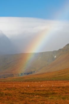 Beautiful rainbow over the mountains, North Fjords Iceland