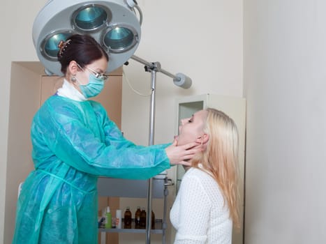 doctor listening to patients heartbeat