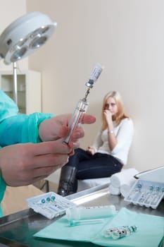 doctor listening to patients heartbeat