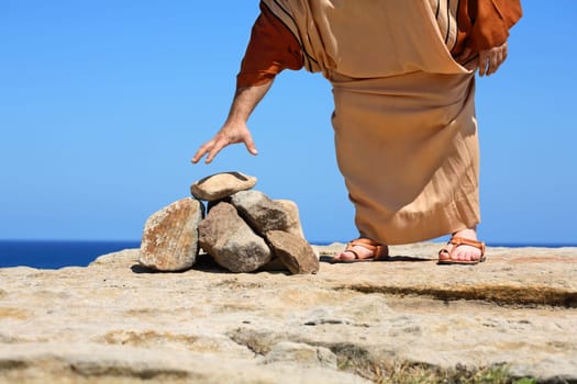 Man by stones  concept Sin Punishment