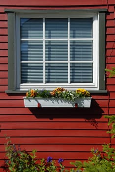 White lattice windows and red house