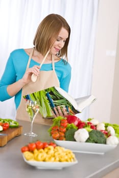 Cooking - Woman reading cookbook