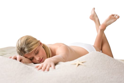 Beach - woman with starfish on sand
