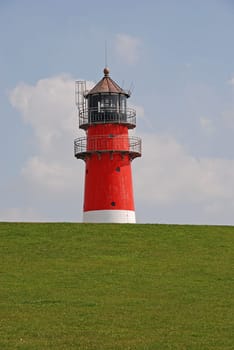 Lighthouse behind the dike