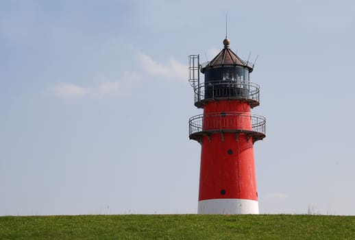 Lighthouse behind the dike