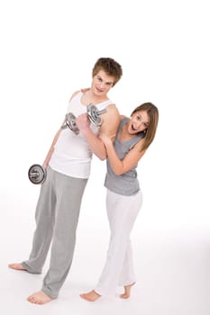Fitness - Young couple exercise with weights
