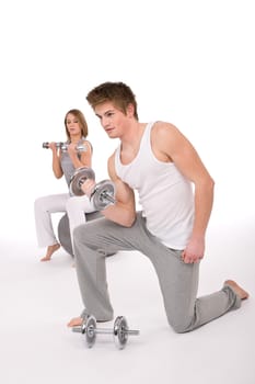 Fitness - Young couple exercise with weights
