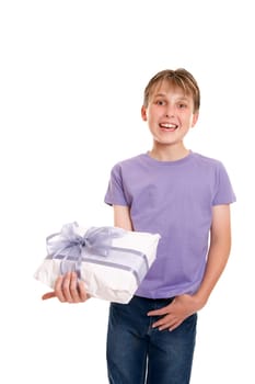 Smiling boy holds a gift wrapped present