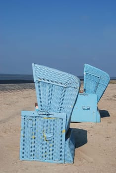 Two blue beach chairs