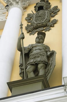 A bronze sculpture of a ancient roman warrior.