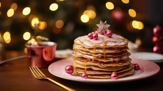 Delicious fresh pancakes with caramel sauce and Christmas decorations stand on a wooden table against a background of blurry bokeh lights, close-up side view.