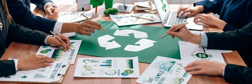 Group of business people planning and discussing on recycle reduce reuse policy symbol in office meeting room. Green business company with eco-friendly waste management regulation concept.Trailblazing