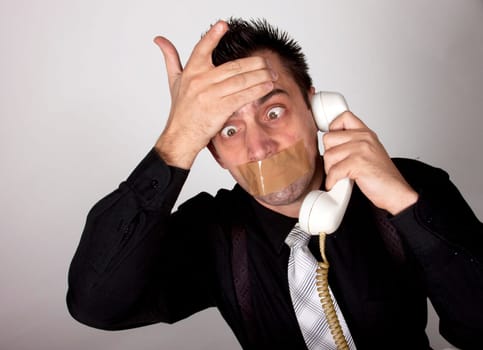 Funny businessman with tape on his mouth