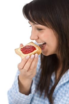 Smiling woman eat healthy toast for breakfast in pajamas