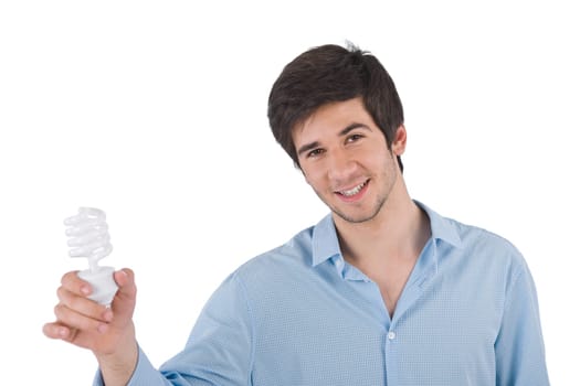 Smiling young man holding energy saving light bulb