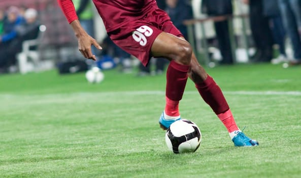 Soccer players fighting for the ball