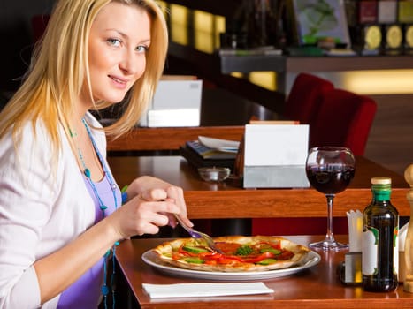 Young Woman Eating Dinner