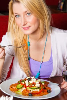 Young Woman Eating Dinner
