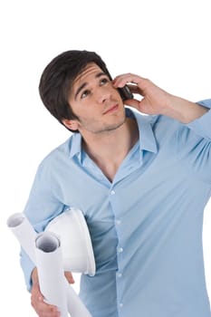 Male architect student with helmet and plans calling