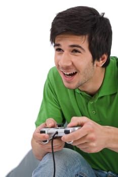 Young happy man playing video game with control pad