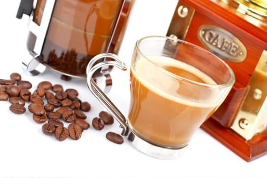 Cup, grinder, coffee pot and beans