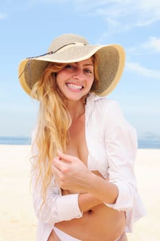 Summer on the beach Woman with straw hat