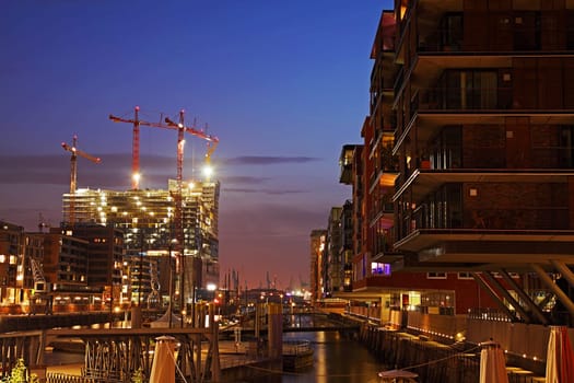 Hamburg Hafencity with construction site Elbphilharmonie in the evening - DRI