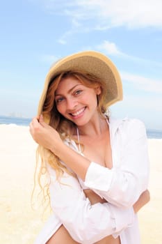 Summer on the beach Woman with straw hat