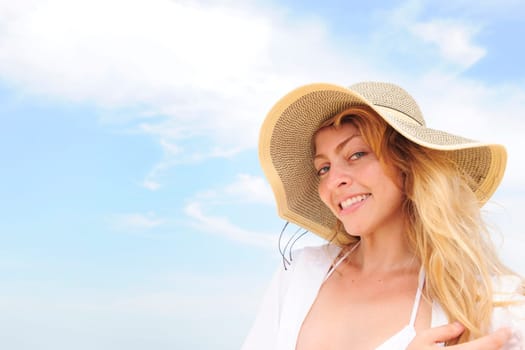 Summer on the beach Woman with straw hat