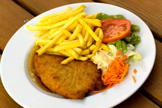 Breaded schnitzel with french fries