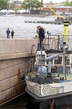 A small vessel at the embankment of Vasili Island in Saint Petersburg, Russia.