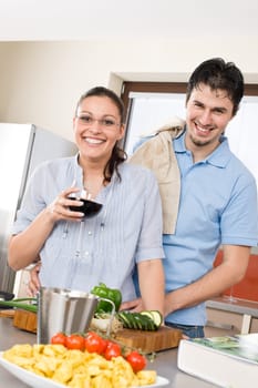 Cheerful couple in modern kitchen