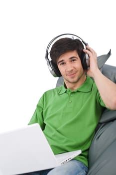 Young man with laptop and headphones