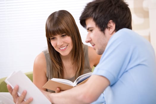 Student - two teenager reading book home