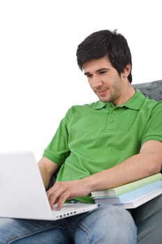 Student - Young man with laptop sitting on bean bag