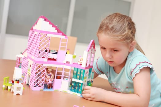 Playing with doll house