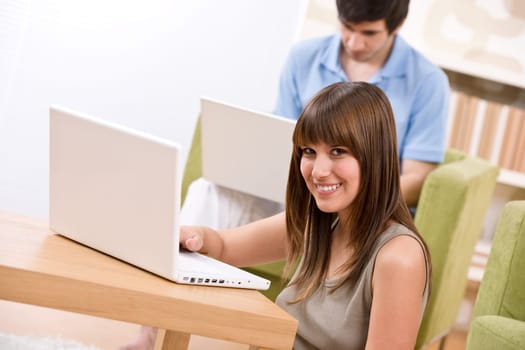 Student - two teenager with laptop in living room