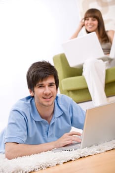 Student - two teenager with laptop in living room