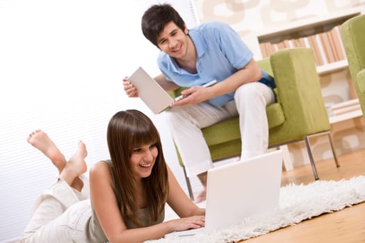 Student - two teenager with laptop in living room
