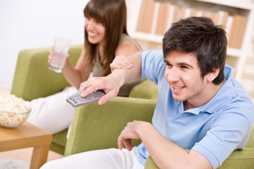 Students - happy teenagers watching television