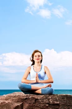 Young girl meditating outdoors