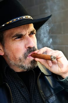 Bearded man smoking cigar