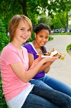 Girls eating pizza