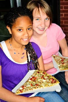 Girls eating pizza