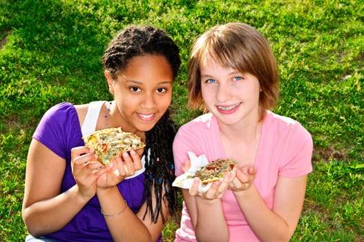 Girls eating pizza