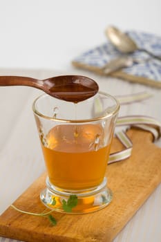 Honey drops in a jar