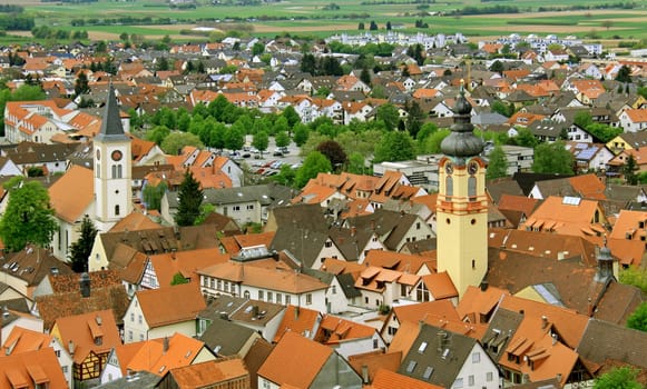 View from the Mount of Olives via Schriesheim to the northwest into the Rhine Valley Right: Catholic Parish Church of the Assumption of the Virgin Mary Left: Evangelical City Church of Schriesheim